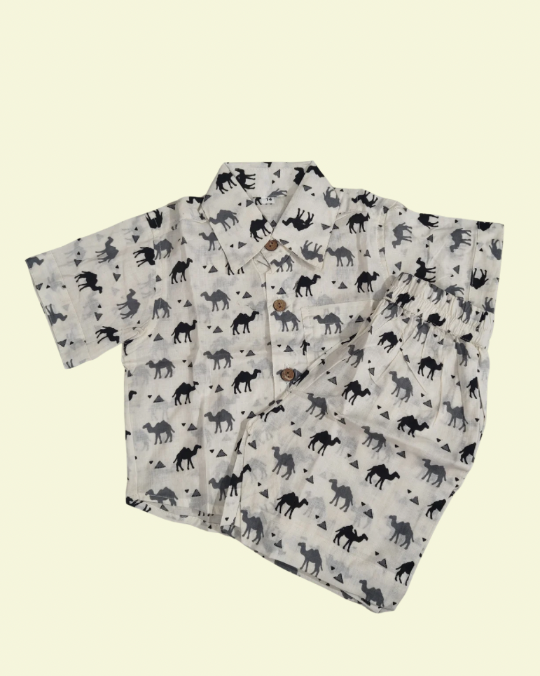 A camel solid printed white boys premium cotton fabric collared shirt with matching pant