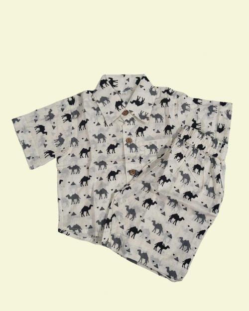 A camel solid printed white boys premium cotton fabric collared shirt with matching pant