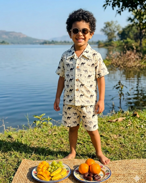 A boy wearing camel solid printed white boys premium cotton fabric collared shirt with matching pant
